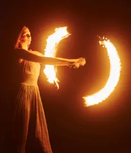 Evening entertainment featuring a skilled fire artist, a highlight of desert experiences in Al Awir Dubai